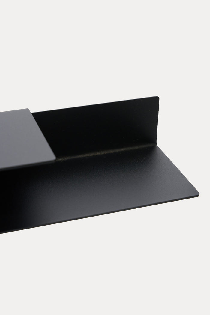 Macro detail of an ATYP powder coated steel floating shelf edge