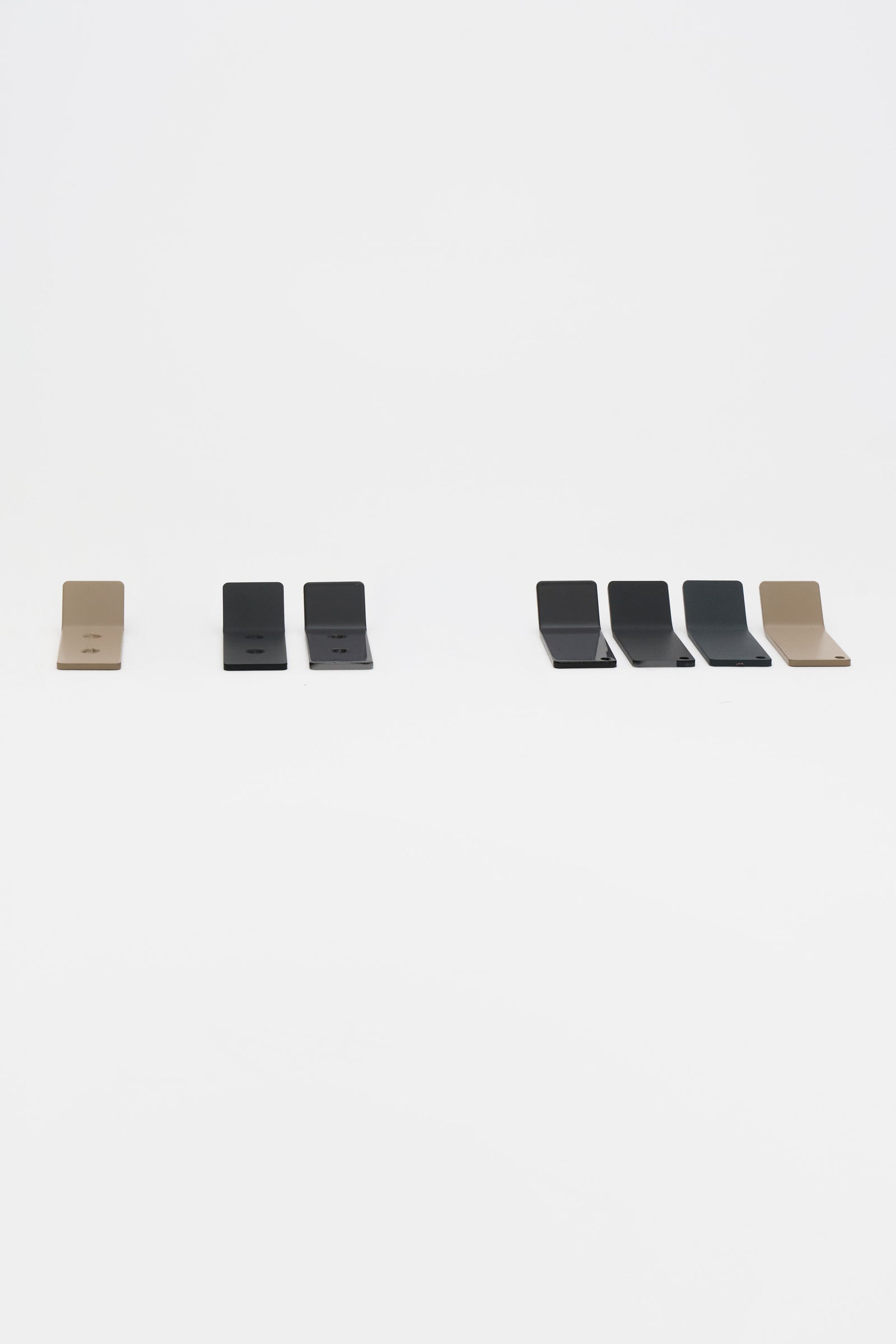 ATYP powder coated steel pieces for a modern home, laid out together in the studio