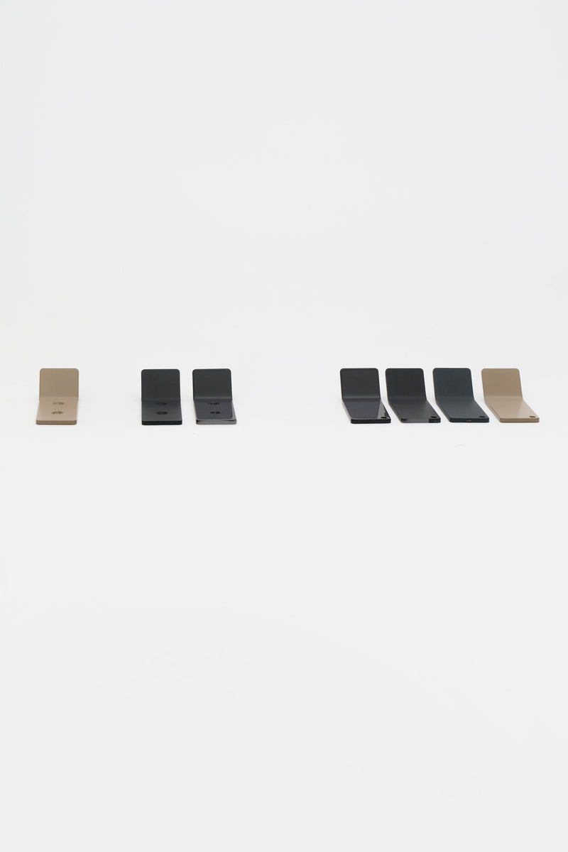 ATYP powder coated steel pieces for a modern home, laid out together in the studio