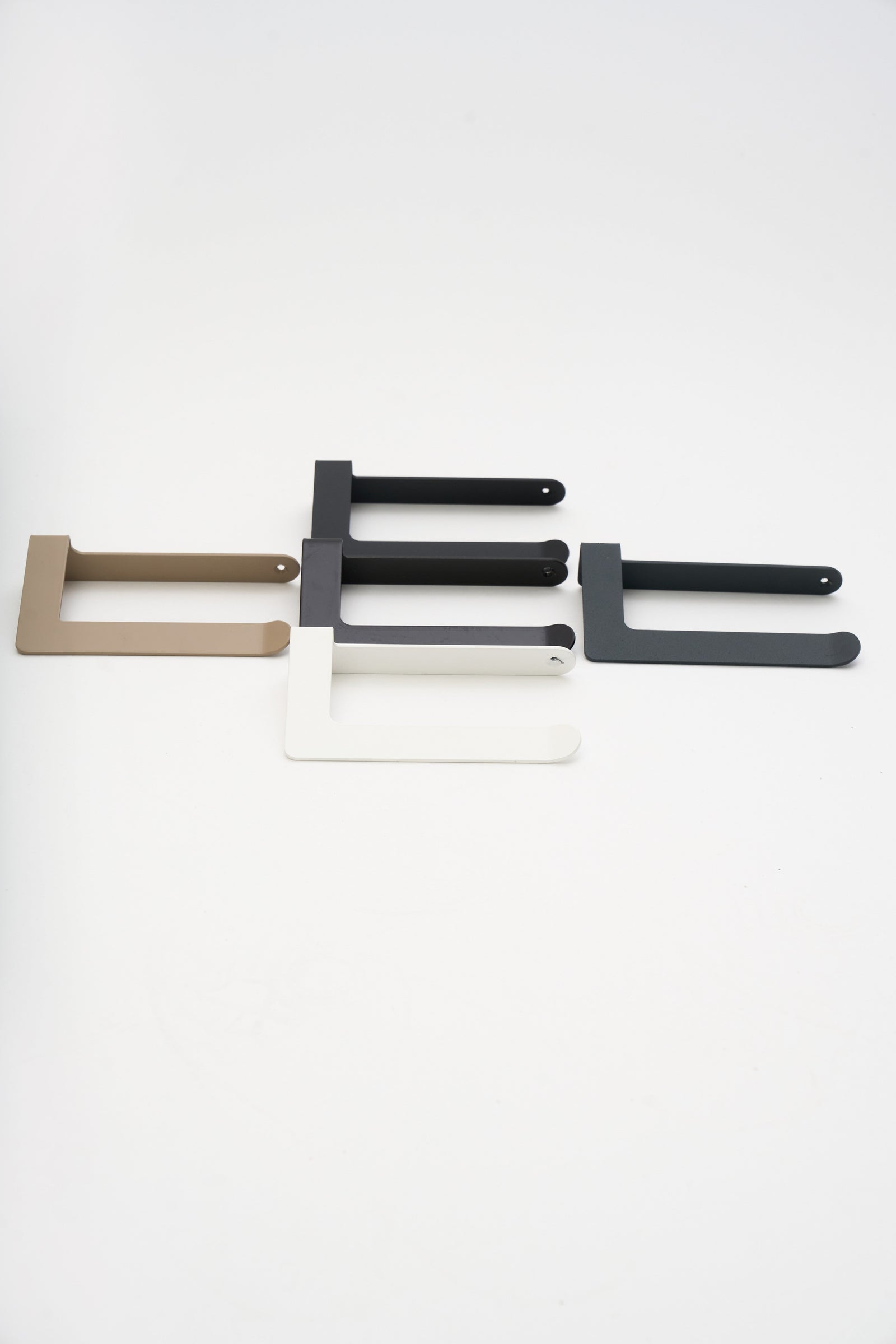 Durable powder coated ATYP steel pieces in several finishes, studio flat lay