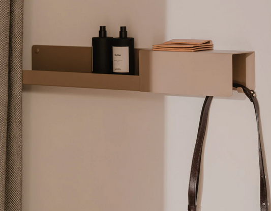 Inside the ATYP Slovak furniture workshop in Bánovce nad Bebravou: a TONE Shelf with Hooks in powder-coated steel.