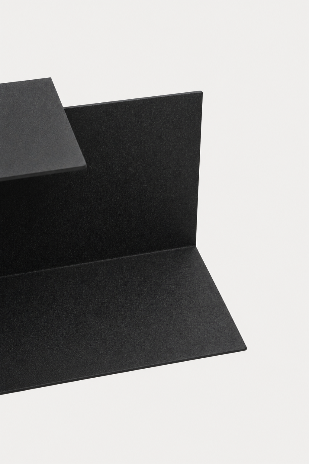 LYNX floating shelf in Graphite powder coated steel, RAL 9005, close crop of L-profile, jet black