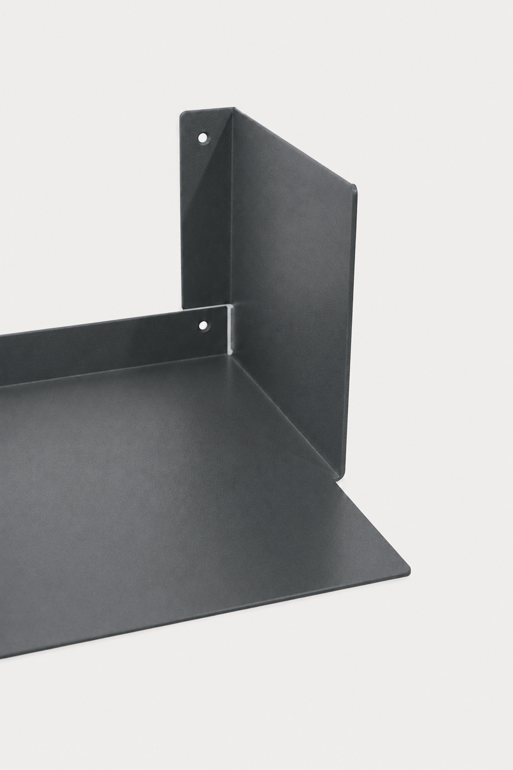 LUMO living room shelf in Slate powder coated steel, RAL 7016, corner close-up of the U profile, two mounting holes