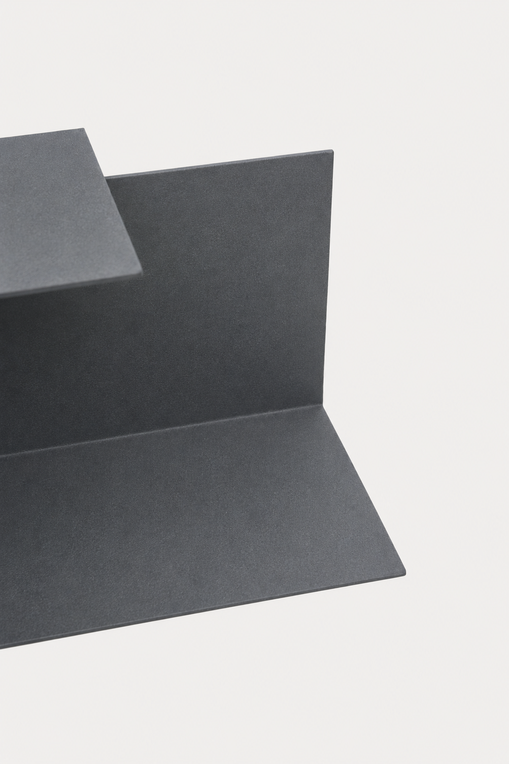 The full ATYP family of powder coated steel pieces laid out together in the workshop studio.
