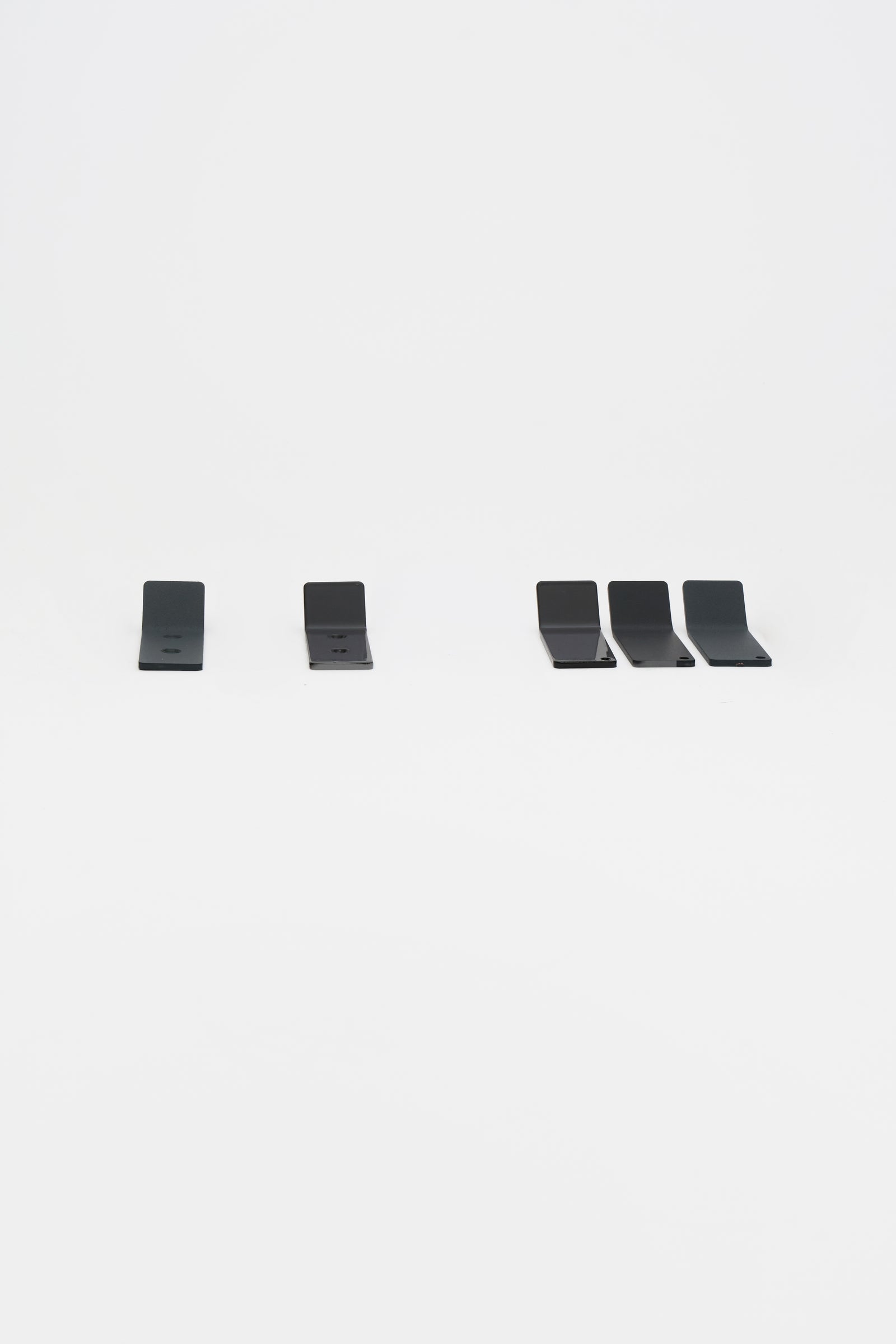 A made to order set of ATYP steel pieces laid out flat before packing, each one built after it was ordered.
