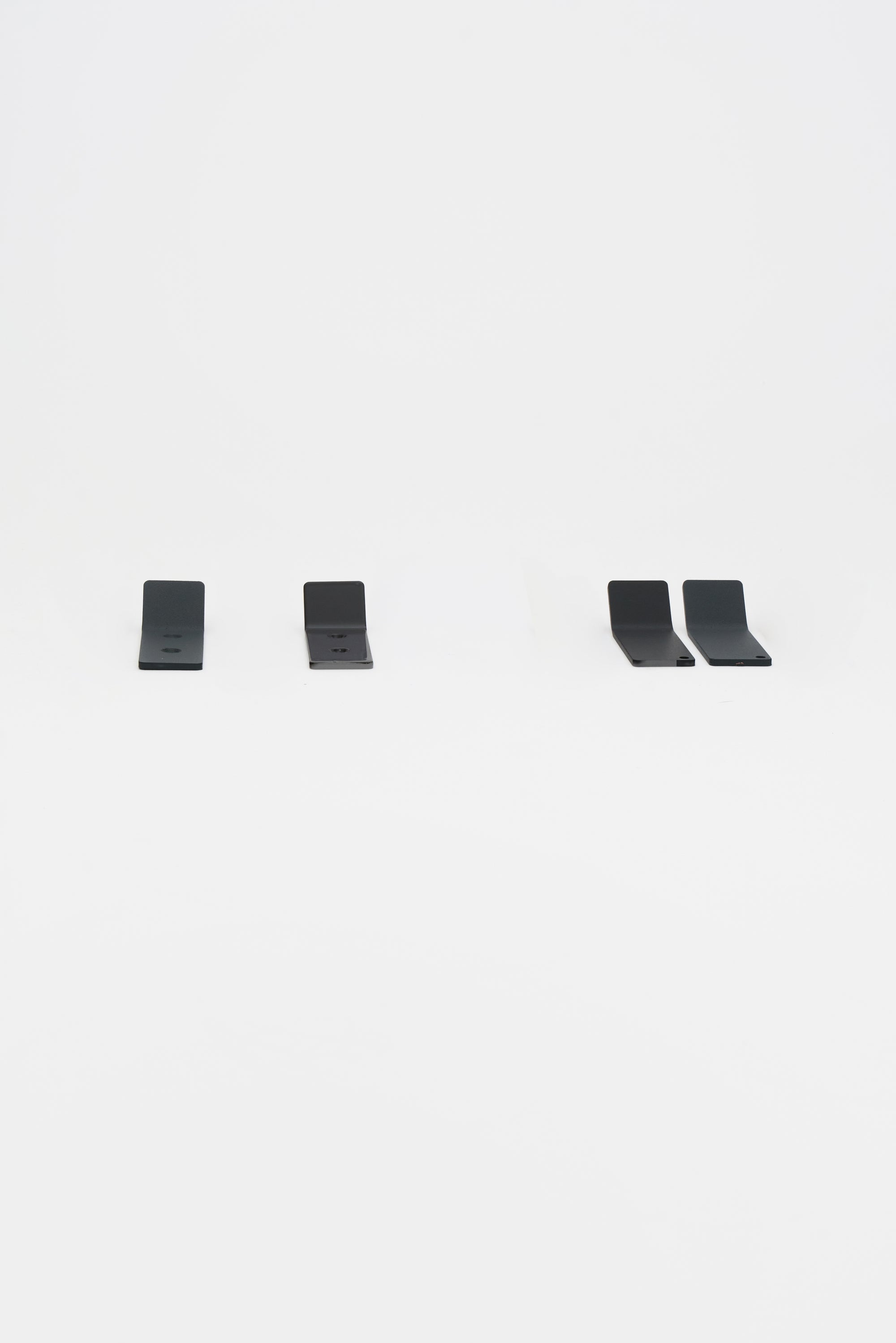 Finished powder coated ATYP pieces from the Slovak workshop, arranged as a studio flat lay.