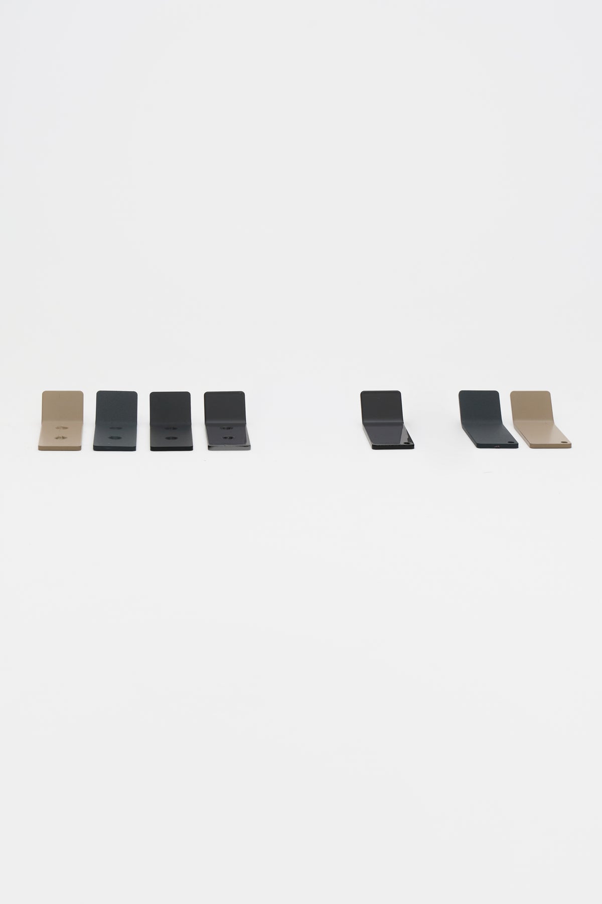 A curated group of ATYP powder coated pieces showing the range of custom shapes we build.