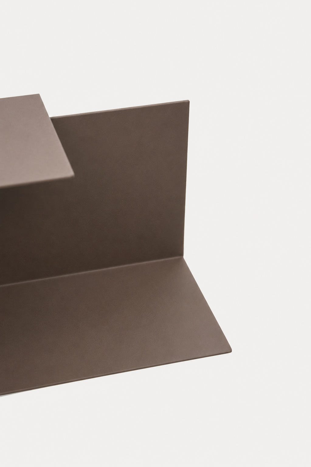 LYNX floating shelf in Umber powder coated steel, RAL 8022, close crop of L-profile, dark warm brown black
