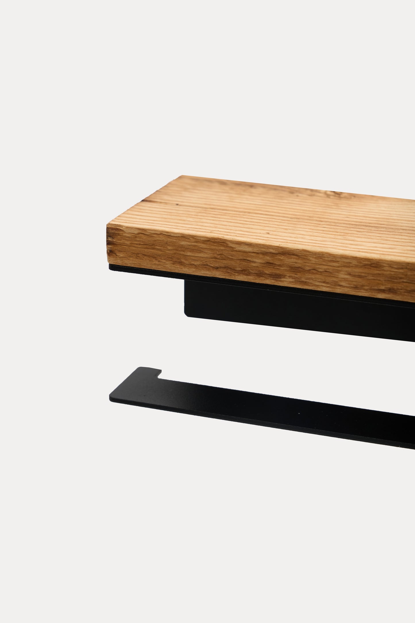 NYVE toilet paper holder in powder coated steel, rustic oak wood top mounted over the black steel holder and hook arm