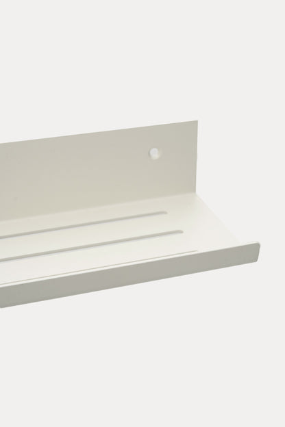 ELIORA shower shelf in Chalk powder coated steel, close-up of the slotted tray, bright white, lip at the front edge