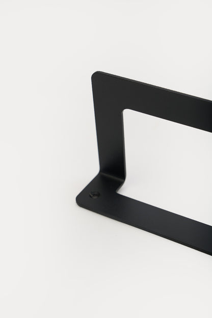 KANSO towel holder in powder coated steel, macro of the bracket corner and rail, jet black, smooth matte