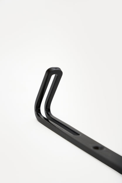 AIKI wall hook in powder coated steel, angled macro of the forked prong top and slot, jet black