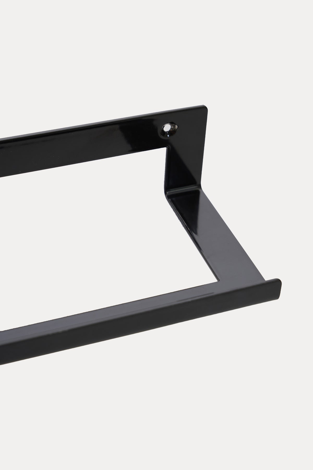 KANSO towel holder in powder coated steel, macro of the bracket and rail with a soft sheen, deep black