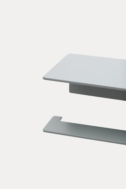 NYVE toilet paper holder in powder coated steel, close-up of the top shelf and hook arm in a pale grey powder coat