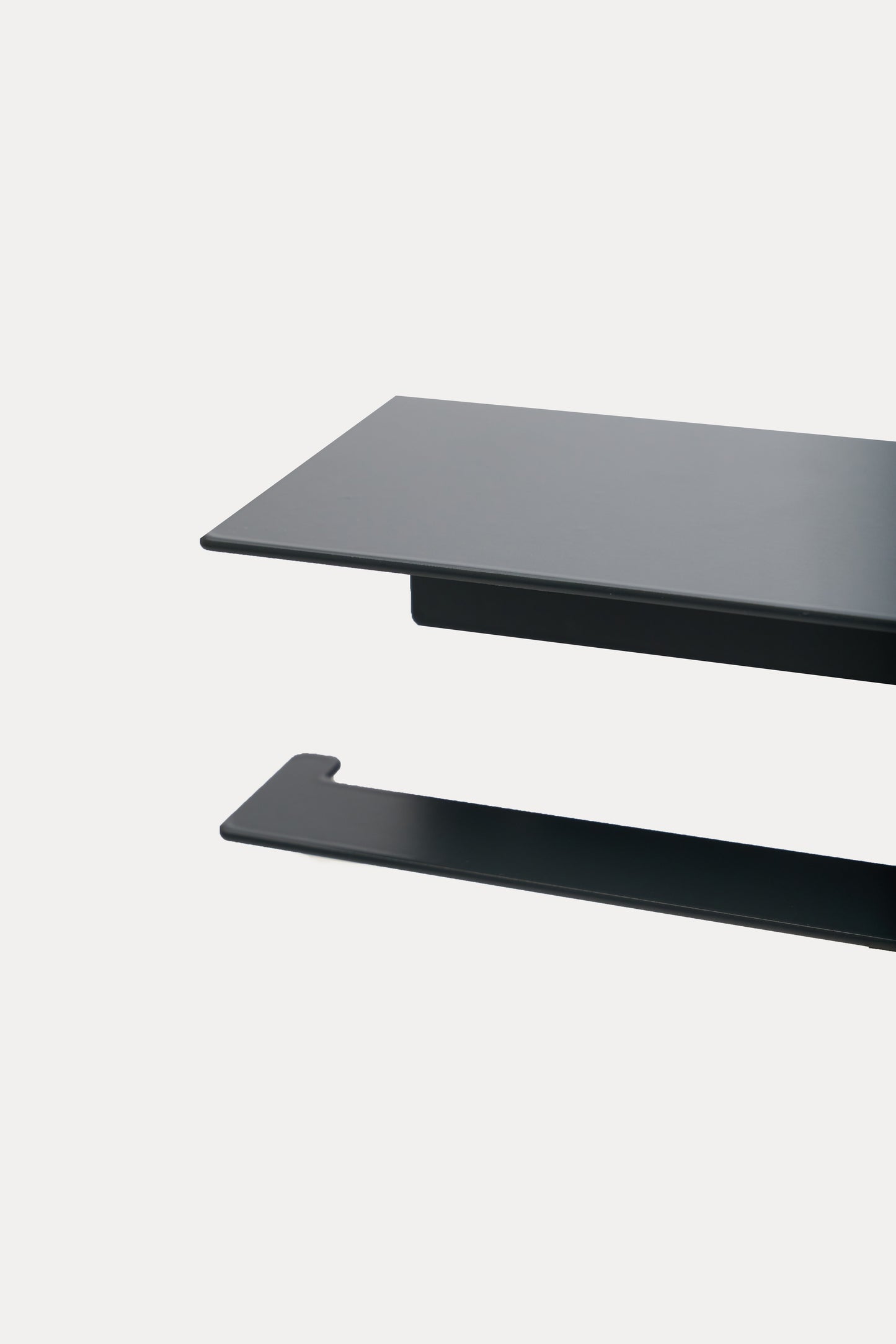 NYVE toilet paper holder in powder coated steel, close-up over the top shelf and arm, dark matte anthracite