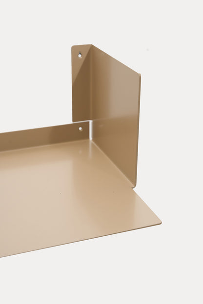 LUMO living room shelf in Linen powder coated steel, corner close-up of the U-profile with side wall and base, warm beige