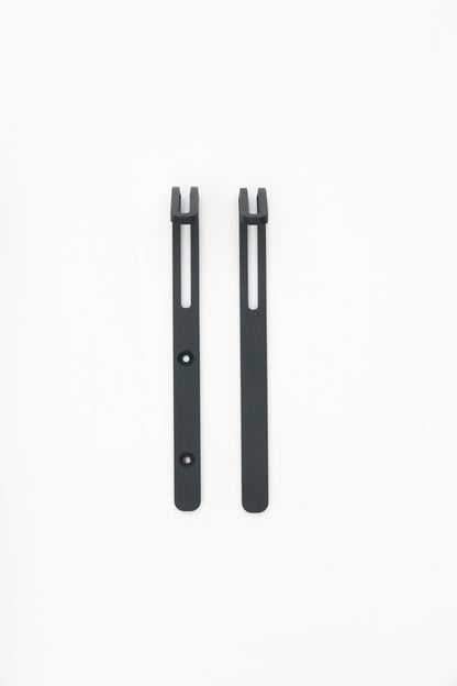 AIKI wall hook in powder coated steel, screw and tape versions side by side, dark anthracite grey with visible grain