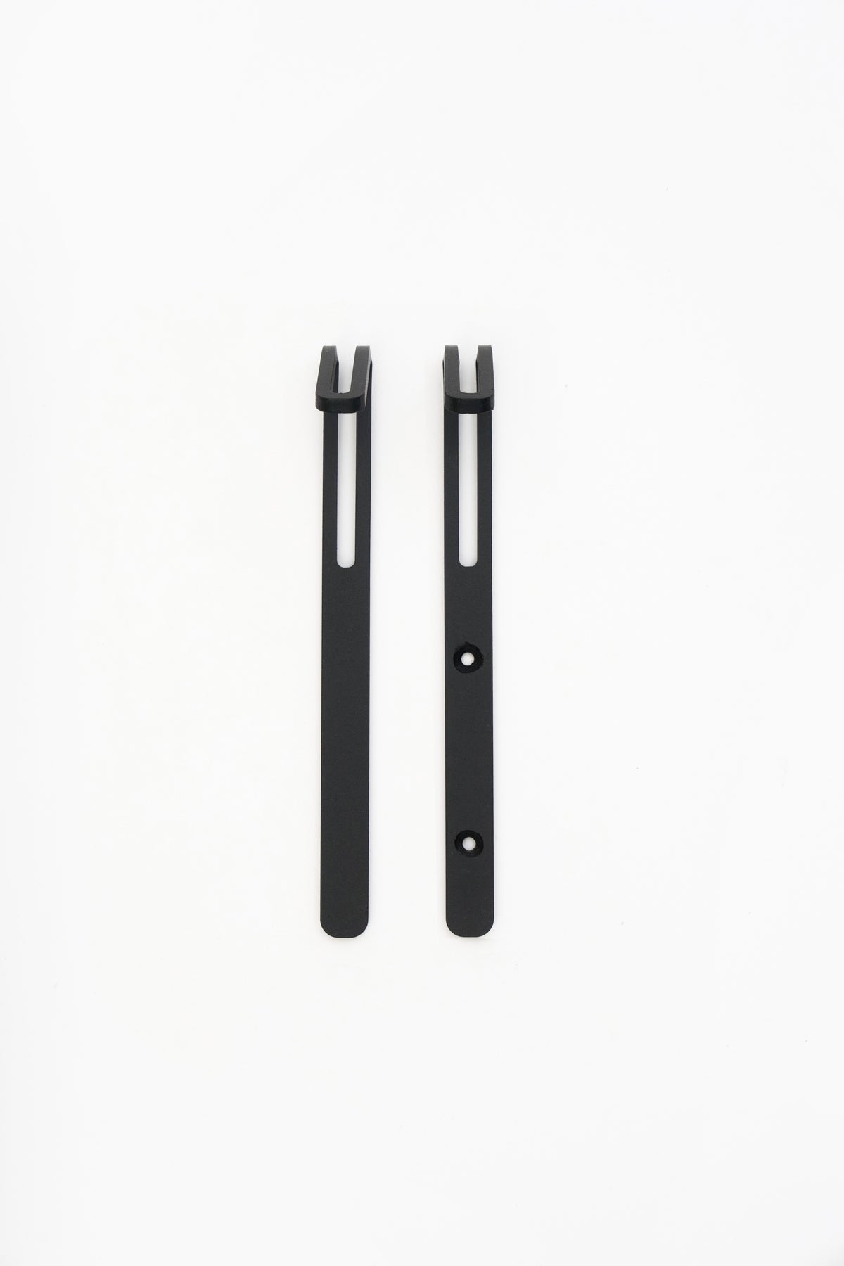 AIKI wall hook in powder coated steel, screw and tape versions side by side, matte black