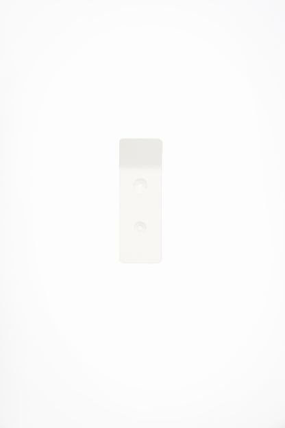 CORE wall hook in Chalk powder coated steel, front view of the screw-mount hook, soft white, two screw holes