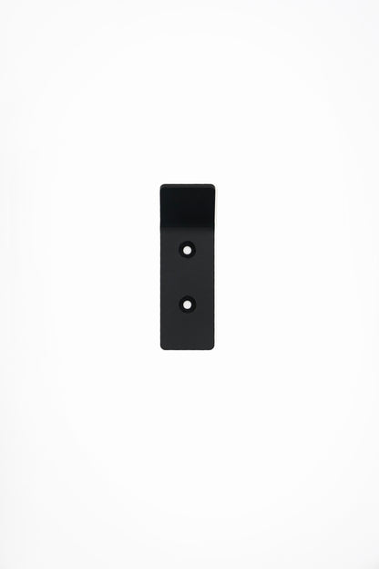 CORE wall hook in Graphite powder coated steel, front view of the screw-mount hook, jet black, two screw holes