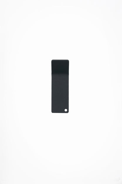 CORE wall hook in Slate powder coated steel, front view of the tape-mount hook, dark anthracite grey, punched corner hole