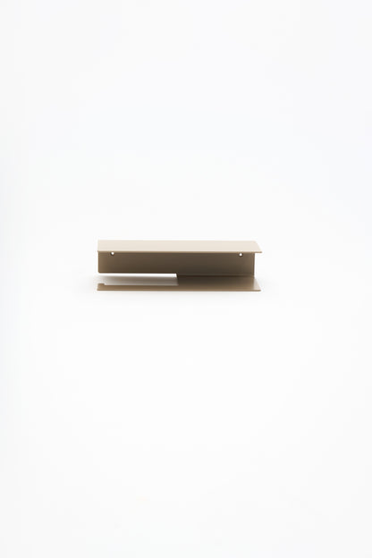 NYVE toilet paper holder in Linen powder coated steel, full front view of the compact holder, warm beige