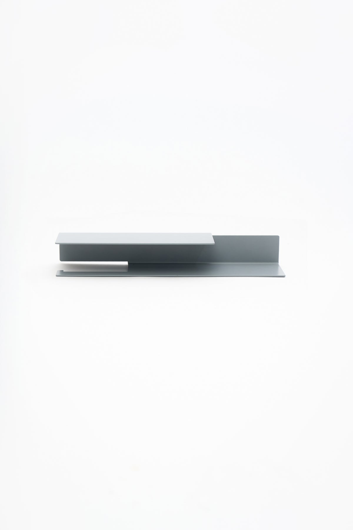 NYVE toilet paper holder in powder coated steel, full front view of the medium holder in a pale grey powder coat