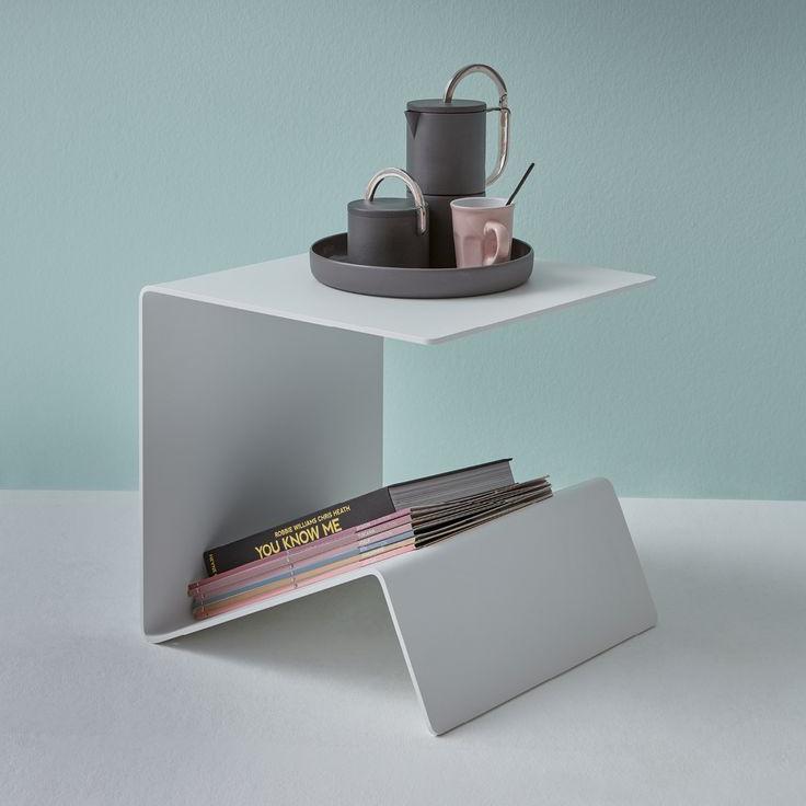 A sleek custom steel table built to measure by ATYP, styled in a modern living room.